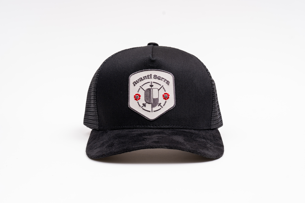 Black trucker hat with embroidered patches and suede brim